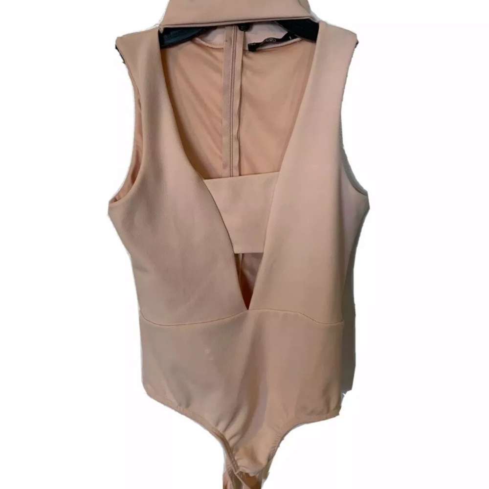Peach bodysuit with deep neck line